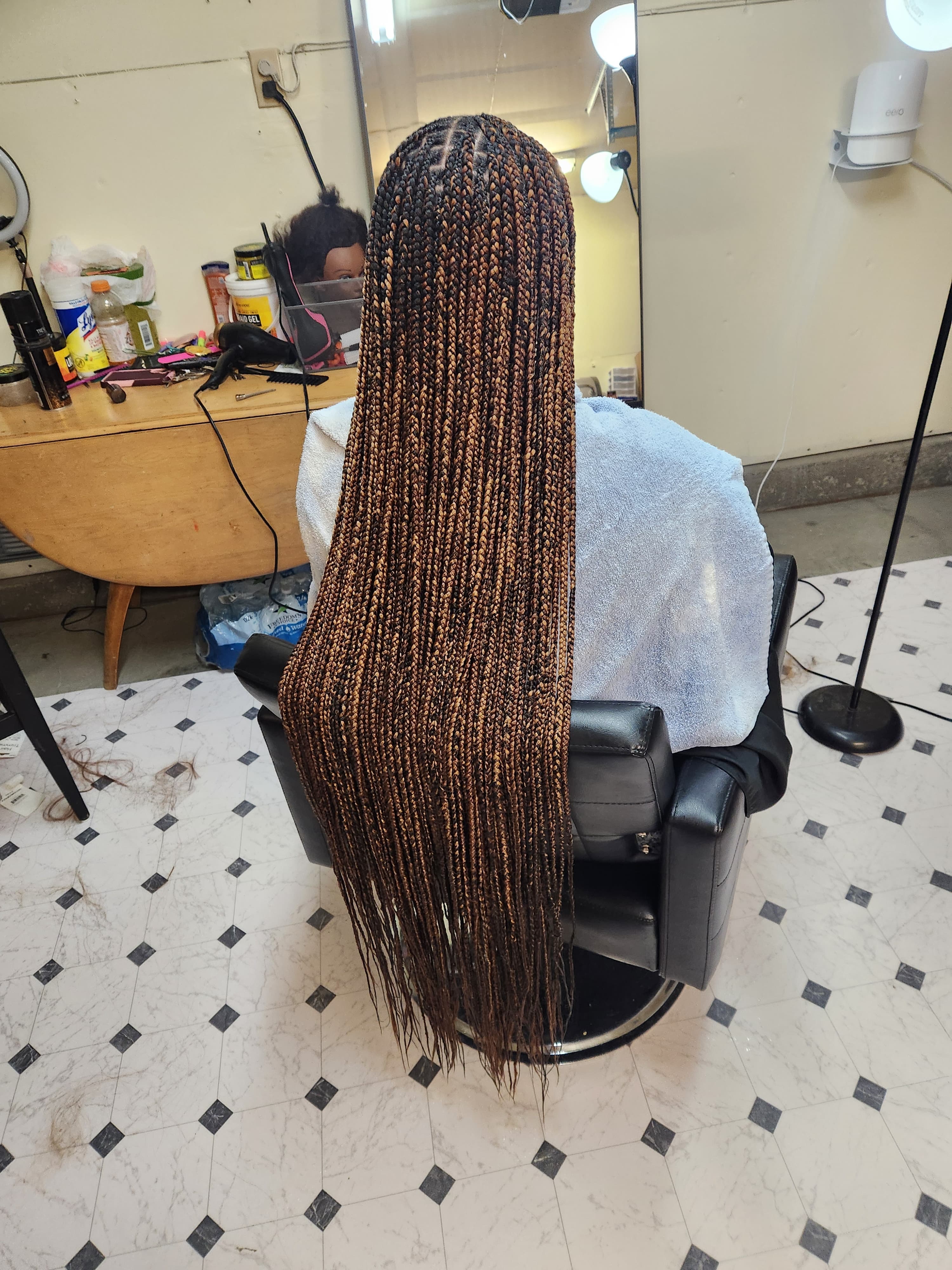 Medium and knees length beautiful knotness braid braided by Murielle Hair Braids in Fort Irwin, California